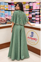 Full back view of the sage green jacket and palazzo pants